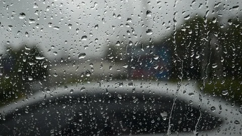 Slow motion, rain drops on window car Stock Footage 96587303