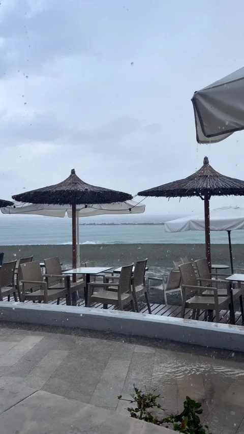 Slow motion rain falling on beach Stock Footage 333077969