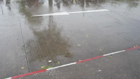 Slow motion, rain falling drop on cement road with arrow sign direction Stock Footage 94178968