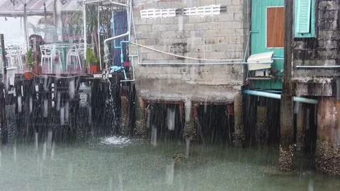 Slow Motion Rain Falling a Restaurant by the sea in Thailand Stock Footage 148357825