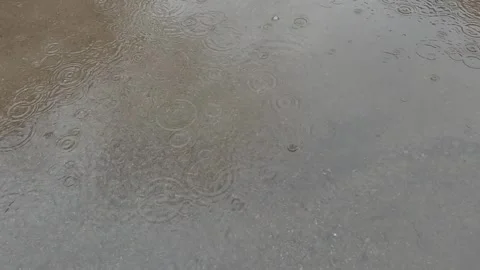 Slow motion of rain falling on the sidewalk Video stock 331852228