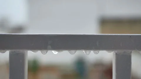 Slow motion rain water drops on white steel grating Stock Footage 128540481