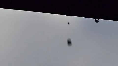 Slow motion of raindrop and dripping on rooftop. Stock Footage 306558874