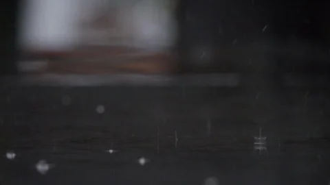 SLOW MOTION : Raindrop falling on ground Stock Footage 94907475