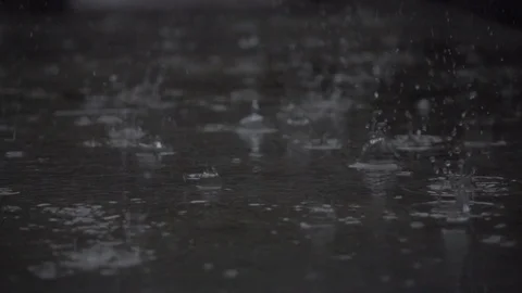 SLOW MOTION : Raindrop falling on ground Stock Footage 94907548