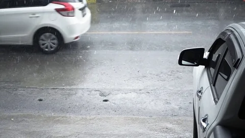 Slow motion of raindrop on the road while car running Stock Footage