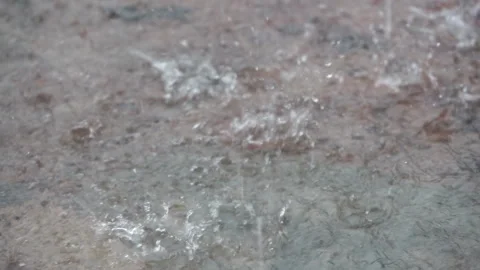 Slow motion Raindrops hitting the ground in the rainy season Stock Footage 276720149