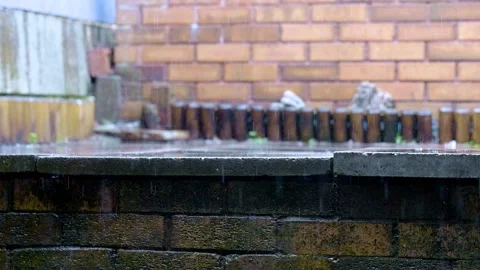 Slow motion rainfall on a set of slabs Stock Footage 135993464