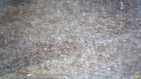 Slow motion raining dropping on ground flood Stock Footage 86947797