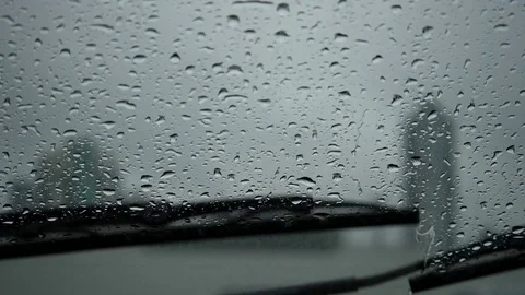 Slow motion of rainy day view during car windshield wipers Stock Footage 76182969