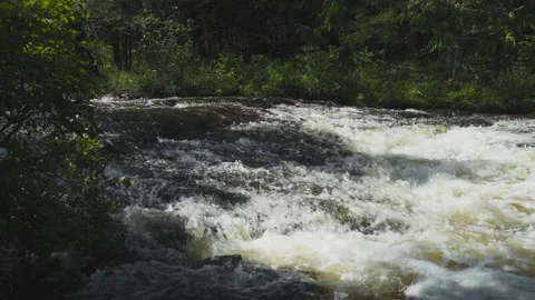 Slow motion of rapid river water over rocks Stock Footage 166625182