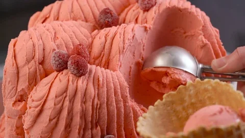 Slow motion of raspberry gelato ice cream being scooped close up Stock Footage 75515355