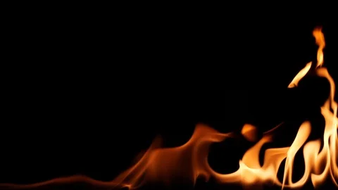 Slow motion real fire flame igniting and burning on black background Stock Footage 125387524