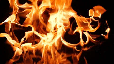 Slow motion real fire flame with sparks igniting and burning on black background Stock Footage 125560897