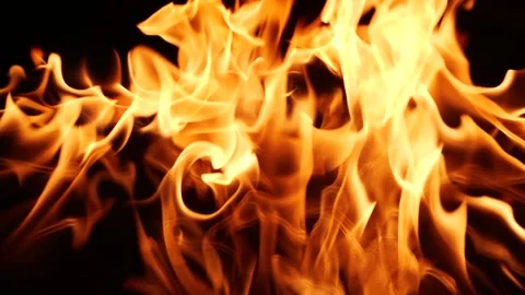Slow motion of real fire flame with sparks burning on black background Stock Footage 134456099
