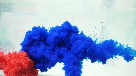 Slow motion red and blue real shot ink or color paint inject in water. Stock Footage 88013970