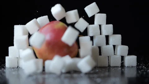 Slow Motion Red Apple Breaking Through Wall of Stacked White Sugar Cubes. H.. Stock Footage 300736138
