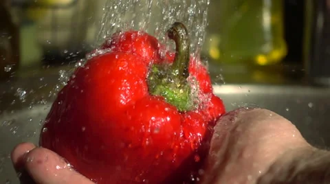 Slow Motion Red Bell pepper washed under the tap Video stock 68672742