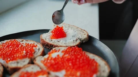 Slow Motion Red Caviar Spread On Buttered Bread Slice Close Up Delicious Food Stock Footage 312379317