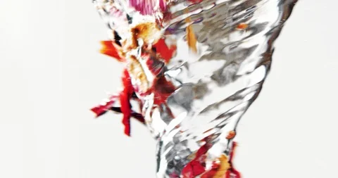 Slow motion of red hibiscus tea being dropped into hot water vortex Stock Footage 124011151