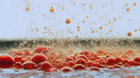 Slow motion of red liquid bubbles in transparent liquid Stock Footage 132188426