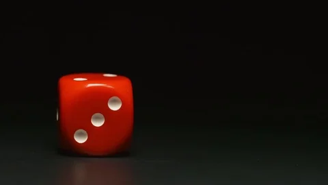 SLOW MOTION: Red playing cube rolls and stop Stock Footage 72495847