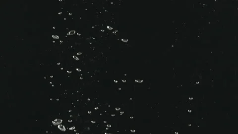 Slow-motion of Red Small Cherry Tomatoes falling into the Water. Stock Footage 171543306