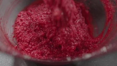 Slow motion Red Velvet Cookie Dough Texture Close Up in Glass Bowl Stock Footage 328892500