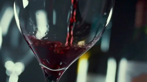 Slow motion red wine being poured into a glass Stock Footage 41383144