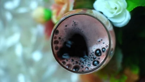 Slow motion of red wine drop in to glass Stock Footage 94018347