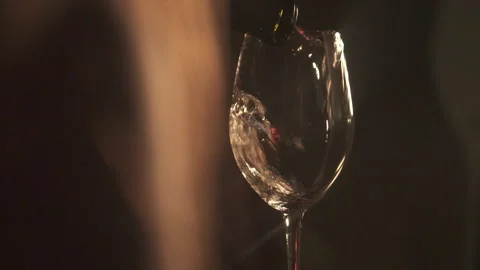 Slow Motion Red Wine Poured From Bottle In Romantic Scene. 120 fps Stock Footage 153813834