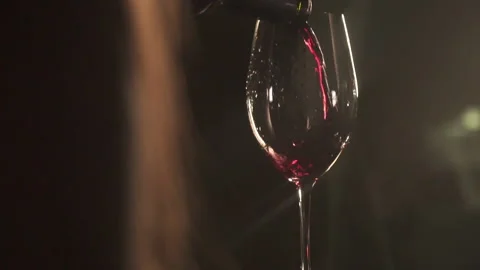 Slow Motion Red Wine Poured From Bottle In Romantic Scene. 120 fps Stock-Footage 153813853
