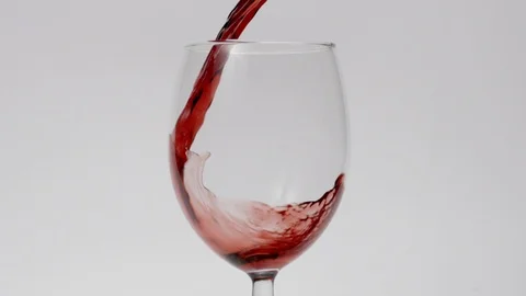 Slow motion red wine pouring into wine glass Stock Footage 108018069