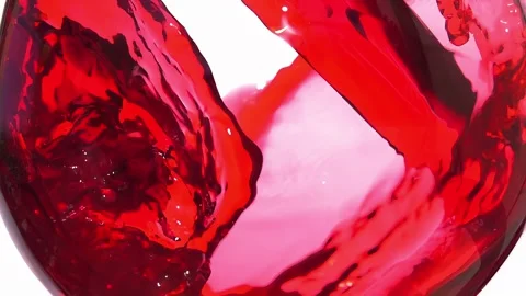 Slow motion Red wine pours into a glass forming a beautiful wave Stock Footage 280008816