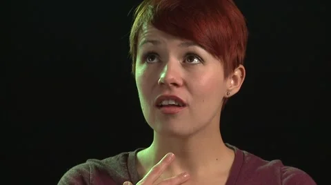 Slow-motion Redhead Looks Down Up, Caucasian, black background Stock Footage 55518486