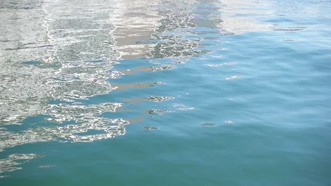 Slow motion reflection of white buildings on the sea surface Video stock 84738003