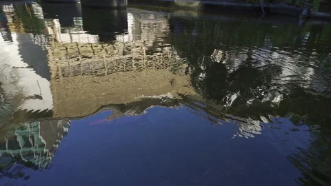 The slow motion reflections of koi pond Manila, Philippines. 動画素材 128516384