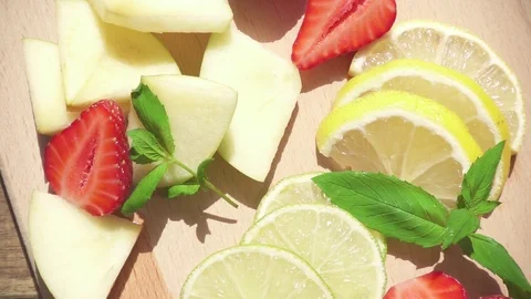 Slow motion a refreshing fruit drink is poured into a glass Stock Footage 90420455
