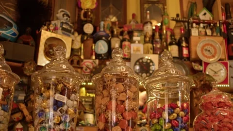 Slow motion reveal of traditional candy jars inside historic café in Lecce Italy Stock Footage 336760662