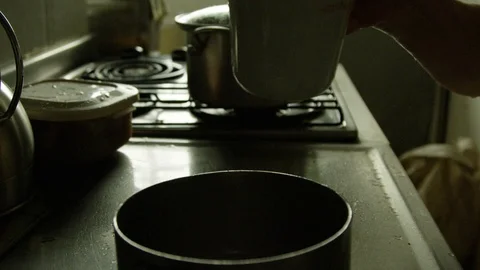 Slow motion of rice being poured on a pot Stock Footage 87813726