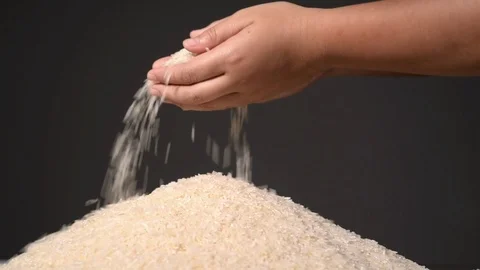 Slow motion of rice fall from little kid hands Stock Footage 87738230