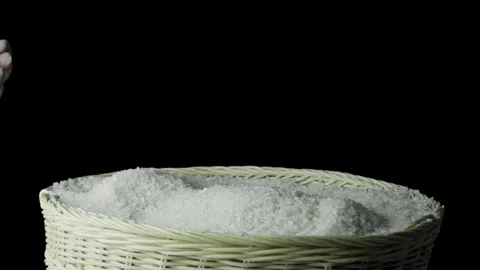 Slow Motion Rice Pouring into Basket Stock Footage 296123713
