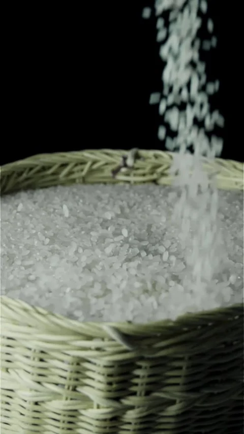 Slow Motion Rice Pouring into Basket Stock Footage 296123775