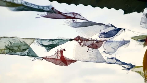Slow motion right to left of prayer flags in Nepal blowing in the wind Video stock 91171561