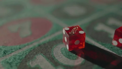 Slow motion right to left tracking dices crossing frame Vídeos de archivo 335699993