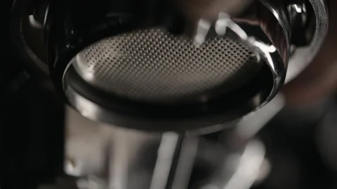 Slow motion rinse coffee machine before pulling espresso with bottomless Stock Footage 154496918