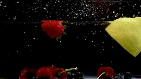 Slow motion ripe strawberry fall in tank full of water Stock Footage 111945887