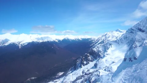 Slow motion on the rising funicular. snow-capped mountains. sochi russia Stock Footage 238361950