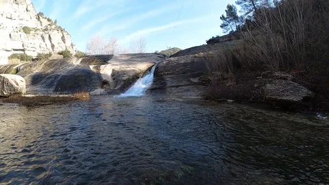 Slow motion of a river and a waterfall Stock Footage 124608525
