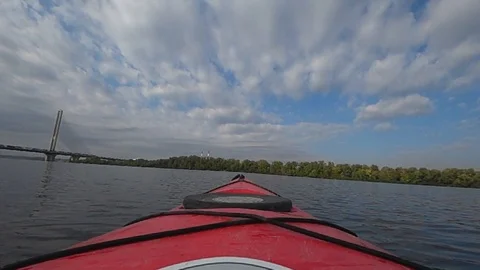 Slow motion river flow in red canoe bridge on the horizon Stock Footage 117115524